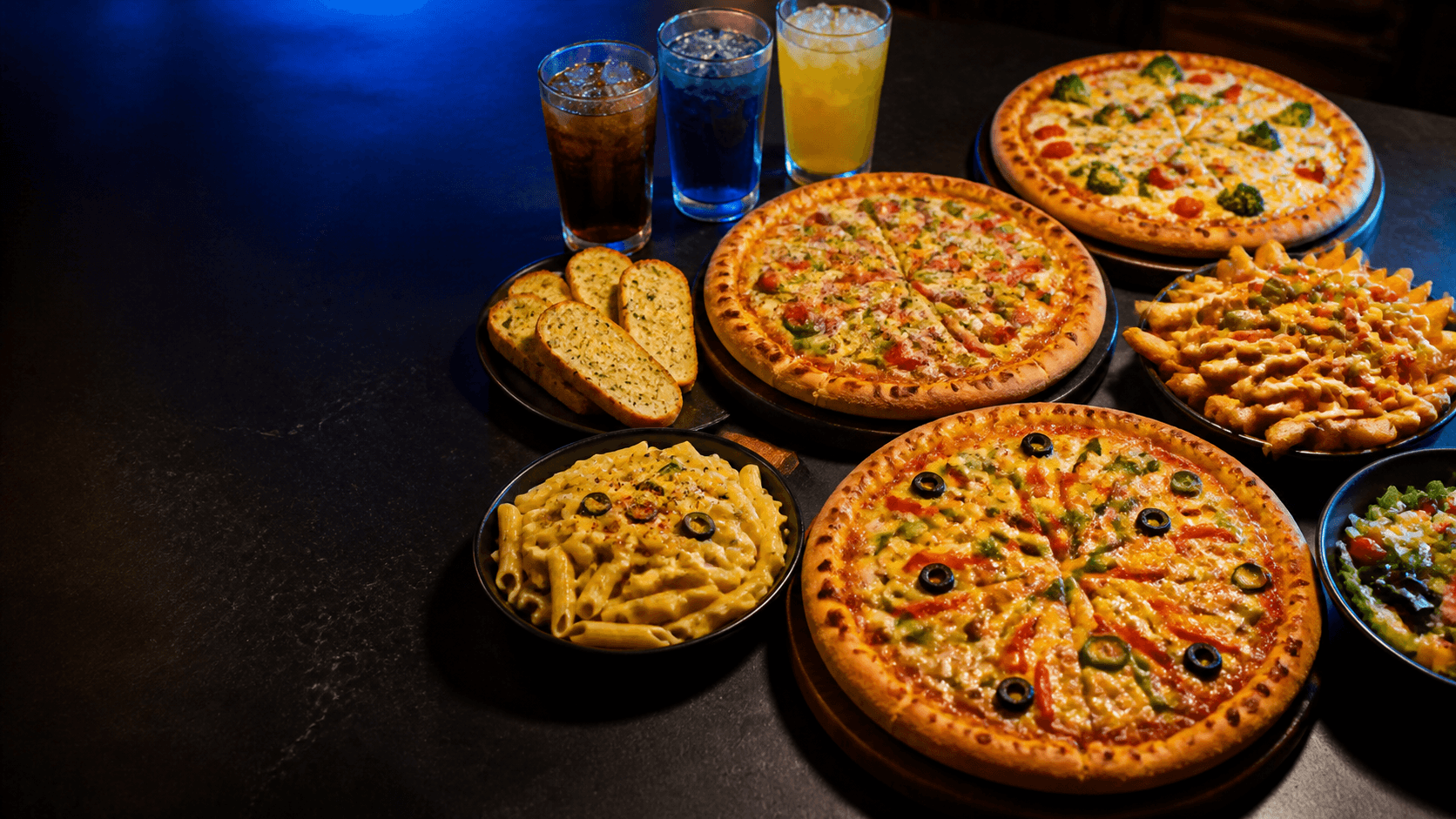 PizzaZone spread — pizzas, garlic bread, pasta, loaded fries and drinks